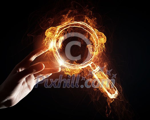 Finger touch glowing light search icon on dark background Finger touch glowing light search icon on dark background