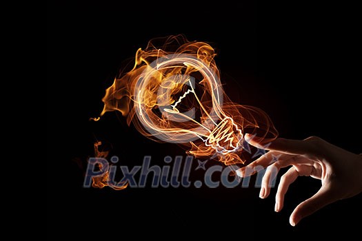 Idea concept with glowing bulb symbol on dark background Idea concept with glowing bulb symbol on dark background