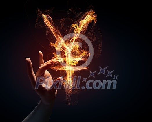 Burning yen sign in businessman palm on dark background
