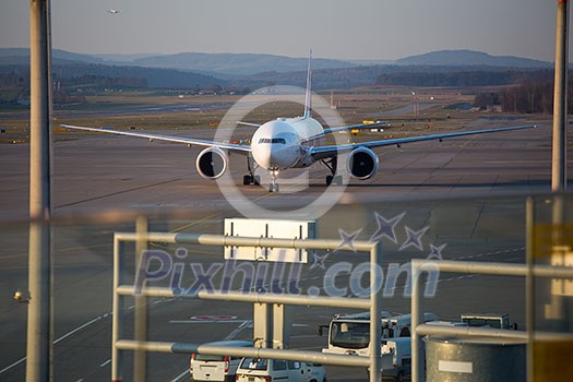 ZURICH - December 3: Planes preparing for take off at the Zurich International Airport (Flughafen Zürich) in Kloten, Switzerland ZURICH - December 3: Planes preparing for take off at the Zurich International Airport (Flughafen Zürich) in Kloten, Switzerland