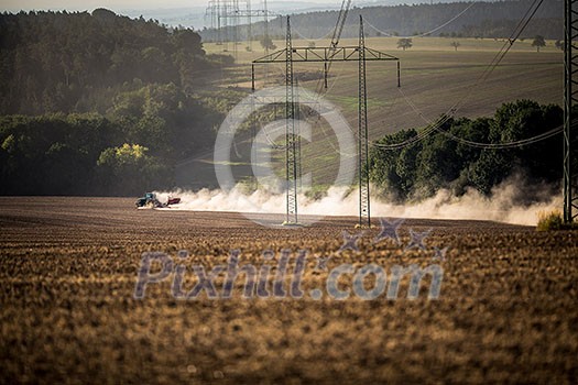 Tractor plowing a dry farm field