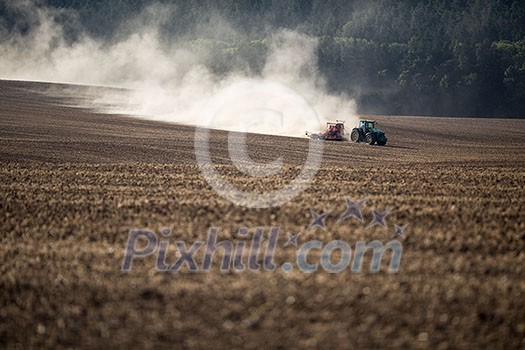 Tractor plowing a dry farm field