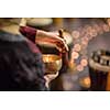 Woman playing on a tibetian singing bowl (shallow DOF; color toned image)