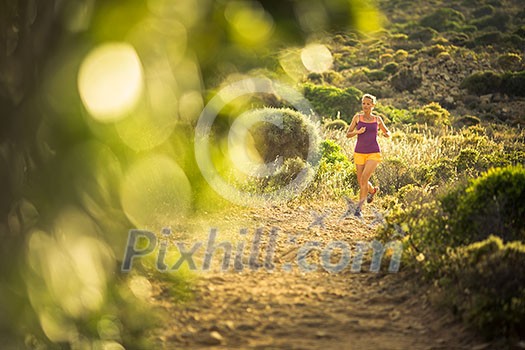 Young woman running outdoors on a lovely sunny day