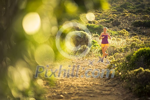 Young woman running outdoors on a lovely sunny day Young woman running outdoors on a lovely sunny day