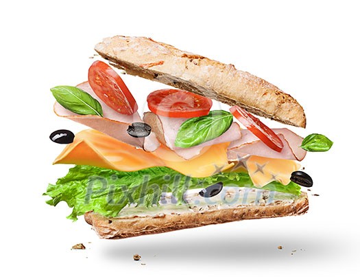 Ciabatta Sandwich with Lettuce, Tomatoes, Ham and Cheese cutted in half flying in the air Ciabatta Sandwich with Lettuce, Tomatoes, Ham and Cheese cutted in half flying in the air