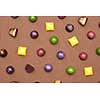 Colorful pattern made of chocolates. Flat lay. Food background.