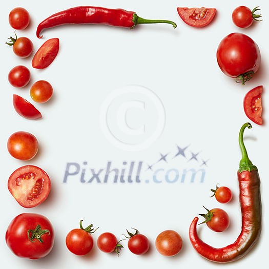 Frame of red tomatoes and chili pepper isolated on white, Unusual place for text about cooking, nutrition, healthy lifestyles, Italian food,