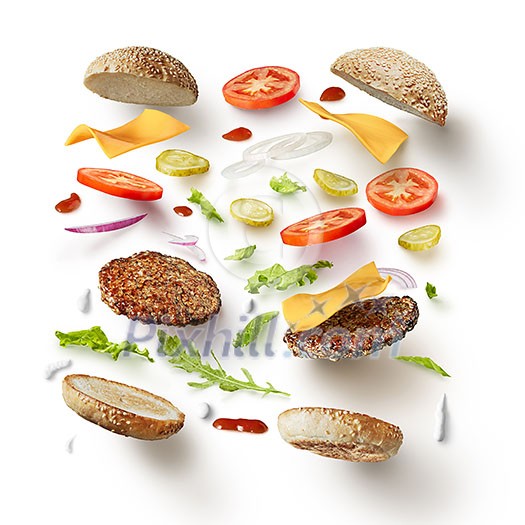 Two burgers with flying ingredients isolated on white background Two burgers with flying ingredients isolated on white background