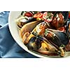 Plate of mussels in garlic sauce horizontal