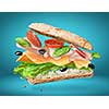Sandwich with falling ingredients in the air isolated on blue - slices of fresh tomatoes, ham, cheese and lettuce
