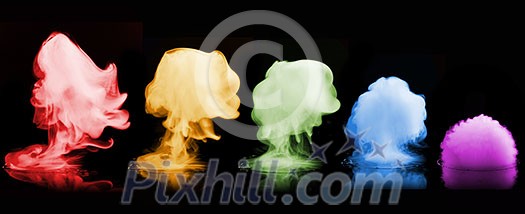 Different color smoke explosions isolated on black background Different color smoke explosions isolated on black background