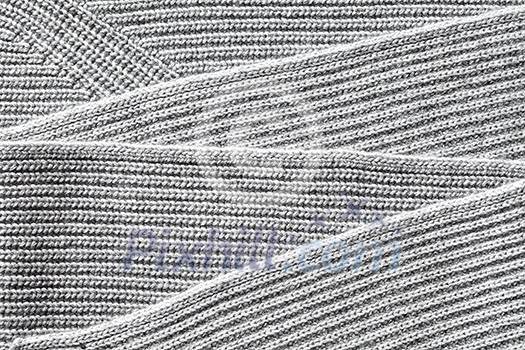 Closeup macro texture of knitted cotton fabric, clothing background with folds Closeup macro texture of knitted cotton fabric, clothing background with folds