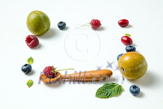 frame with berries on isolated white background