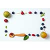 Autumn berries and wooden spoons on a white background. Horizontal photo
