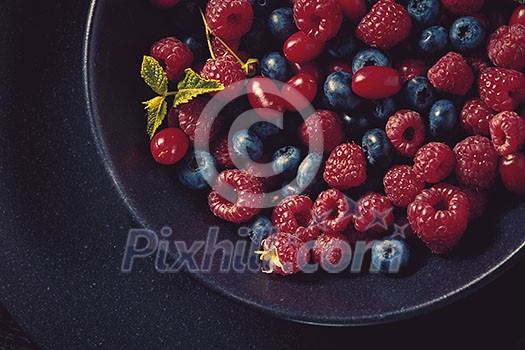 Fresh berries in the bowl. healthy eating food.
