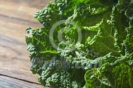 Savoy cabbage super food close up in wooden background