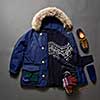 Set of beautiful winter male clothes on a black background. Winter sweater, shoes, gloves, jacket and cap