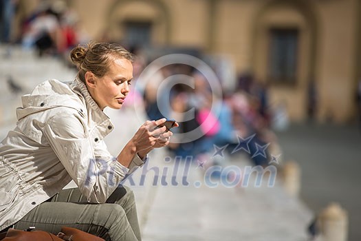 Gorgeous female tourist with a map discovering a foreign city (shallow DOF; color toned image) Gorgeous female tourist with a map discovering a foreign city (shallow DOF; color toned image)
