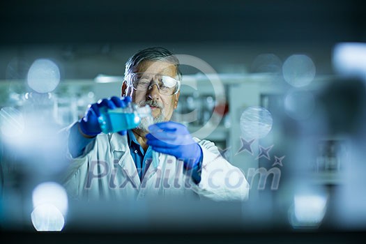 Senior male researcher carrying out scientific research in a lab (shallow DOF; color toned image) Senior male researcher carrying out scientific research in a lab (shallow DOF; color toned image)
