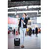 Pretty young female passenger at the airport (shallow DOF; color toned image)