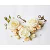Vintage keys with beige roses on the background, Flat lay.
