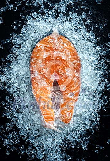 Fresh Raw steak salmon on ice, top view. Fresh Raw steak salmon on ice, top view.
