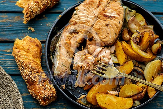 Salmon steak with vegetables on a grill pan. Top view. Selective focus. Salmon steak with vegetables on a grill pan. Top view. Selective focus.