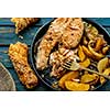 Salmon steak with vegetables on a grill pan. Top view. Selective focus.