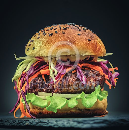 Delicious Homemade hamburger with fresh vegetables. Close-up. Delicious Homemade hamburger with fresh vegetables. Close-up.