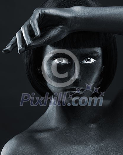 Portrait of a dark-skinned beautiful girl. Black Beauty face. Picture taken in the studio on a black background. Portrait of a dark-skinned beautiful girl. Black Beauty face. Picture taken in the studio on a black background.