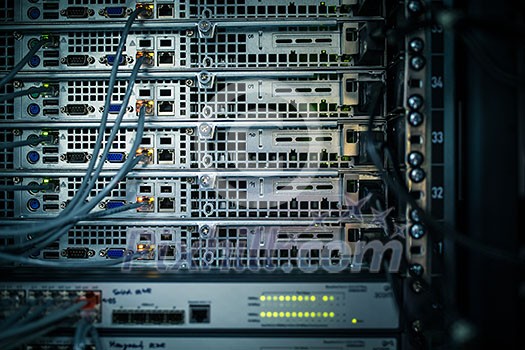 Server rack cluster in a data center (shallow DOF; color toned image)