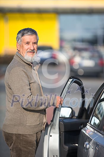 Senior driver getting in his car in a parking lot(color toned image; shallow DOF)