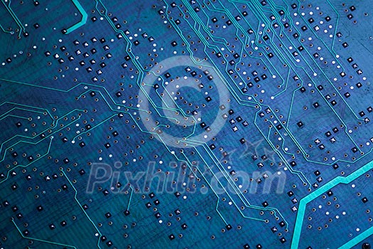 Printed green computer circuit board with many electrical components Printed green computer circuit board with many electrical components