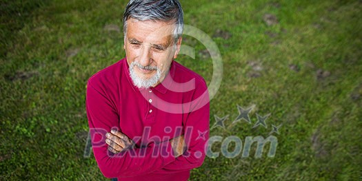 Senior man in his garden - shot from above - interesting angle view Senior man in his garden - shot from above - interesting angle view
