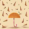 Umbrella made of waffle and waffle cones of rain on a yellow background.