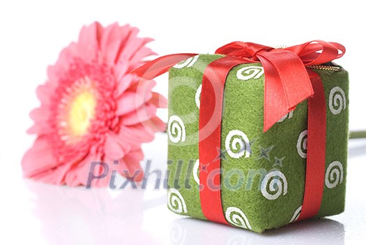 Gift with pink daisy-gerbera on white Gift with pink daisy-gerbera on white