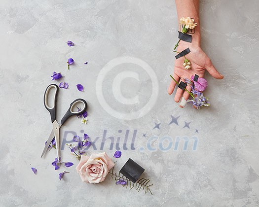 Florist at work. Woman making bouquet of spring flowers Florist at work. Woman making bouquet of spring flowers