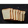 Slices of brown bread and white bread isolated on black background. Loaf of sliced bread for making sandwiches.