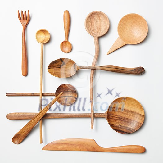 Wooden spoon and knife on a white background Wooden spoon and knife on a white background