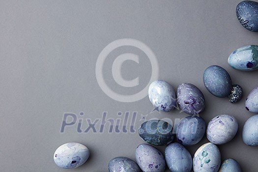 Blue eggs in a corner on a blue background Blue eggs in a corner on a blue background