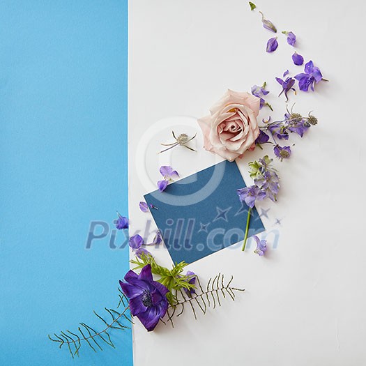 Copy space of navy blue poster may be used for expressing positive emotions. Poster is designed with help of flowers and two backgrounds: white and turquois.