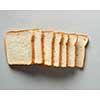 Fresh toasts of bread for sandwiches over light grey background