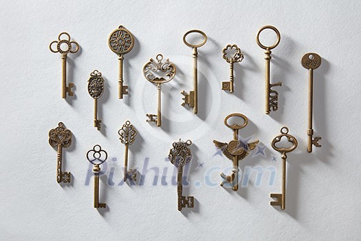 Vintage or antique door keys on white paper