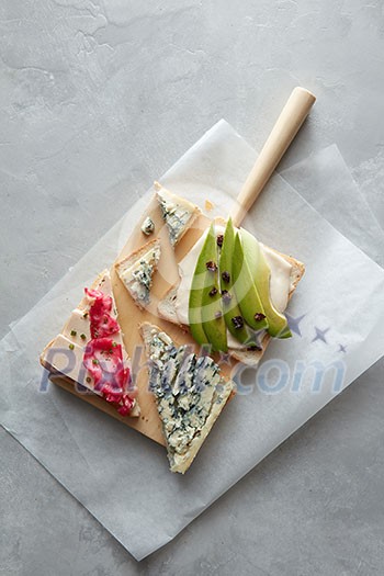 Top view of wooden board with different snacks Top view of wooden board with different snacks