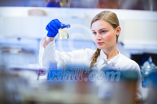 Portrait of a female researcher carrying out research in a chemistry lab (color toned image; shallow DOF) Portrait of a female researcher carrying out research in a chemistry lab (color toned image; shallow DOF)