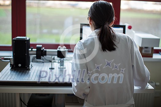 Portrait of a female researcher carrying out research in the lab (color toned image; shallow DOF) Portrait of a female researcher carrying out research in the lab (color toned image; shallow DOF)