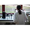 Portrait of a female researcher carrying out research in the lab (color toned image; shallow DOF)