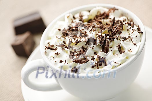 Cup of hot cocoa with shaved chocolate and whipped cream Cup of hot cocoa with shaved chocolate and whipped cream
