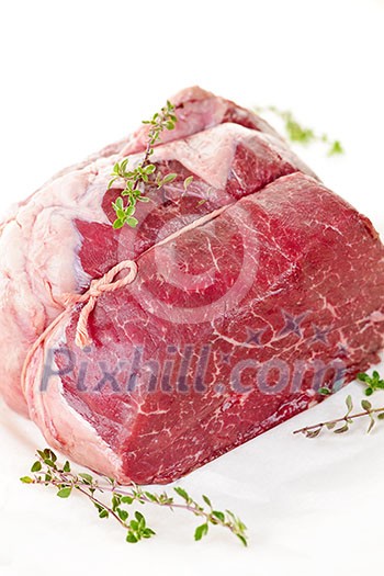 Raw beef roast tied and ready for cooking Raw beef roast tied and ready for cooking